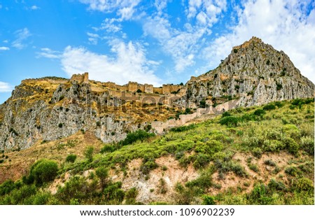Acrocorinth, Upper Corinth, the acropolis of ancient Corinth, is a monolithic rock overseeing the ancient city of Corinth, Greece. Royalty-Free Stock Photo #1096902239