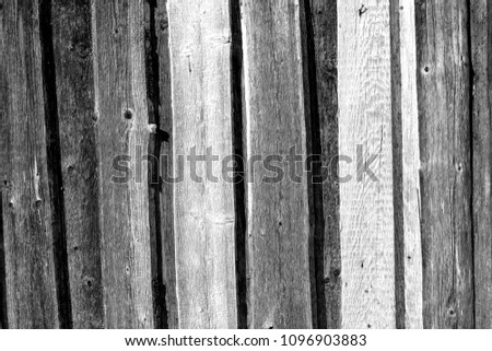 Wooden fence pattern in black and white. Abstract background and texture for design.