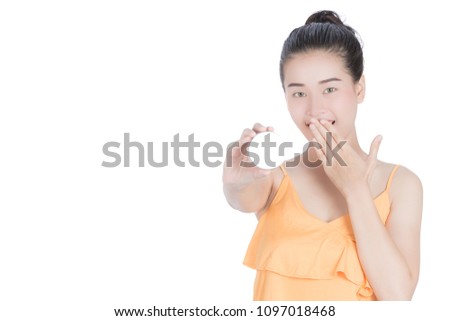 Girl holds the product for presentation. Lady  beautiful  in yellow shirt girl advertising your product on beauty products sign board. Asian female model isolated on white background.
