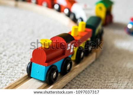 Close up of a toddlers wooden train railway set