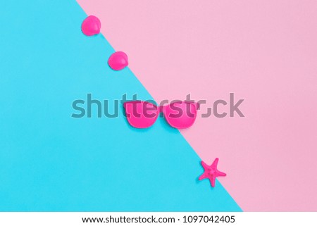 Pink glasses and seashells on colorful background. Minimal concept. Creative concept. Hot Summer Vibes. Pop Art. Bright Sweet fashion Style. Vanilla Pastel Color