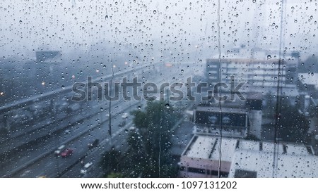 Rain on the window, rain on the window, outside the city window, in the city rain