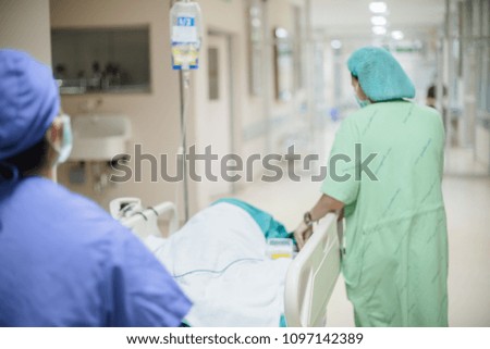 Blurred of medical team moving patient after surgery  in operating room at the hospital.