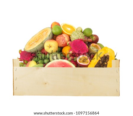 Fresh fruits in wooden box isolated on white background
