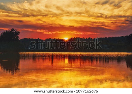 Sunset on the lake. The sun, the sky with clouds and the silhouettes of the opposite bank are reflected in the water. The wooden boat with the fishermen moves along the water.