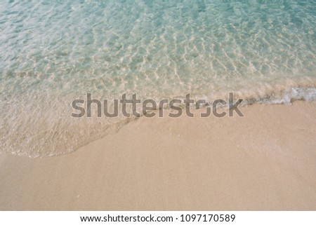 Beautiful background beach in summer. Royalty high-quality free stock image of sea water on the beach with sand and sunshine in summer 