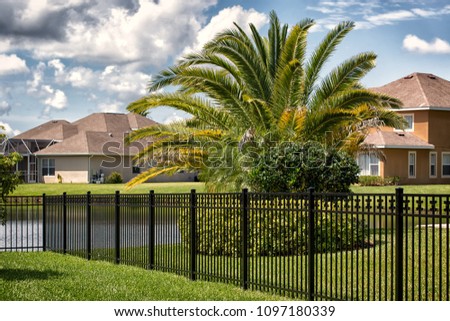 Black Aluminum Fence  Royalty-Free Stock Photo #1097180339