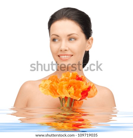 picture of lovely woman with red flowers in water