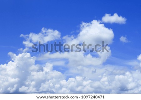 Bright blue sky, white clouds floating in the sky.