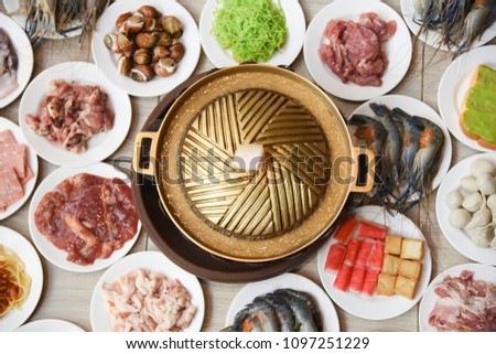 The pan with Various food buffet,Thai Barbecue restaurant. Royalty-Free Stock Photo #1097251229