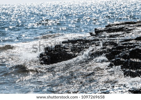 Water breaking on the rocks along the lake Michigan shoreline in a door county wisconsin park