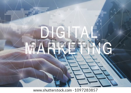 digital marketing concept, promotion of business on social networks, hands typing on computer on background
