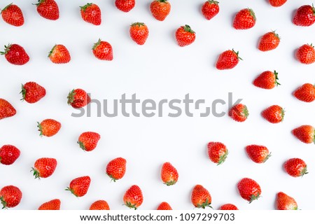 Strawberry on white background, top view. Berries pattern, flat lay. Frame made of fresh strawberry on white background. Creative food concept. Royalty-Free Stock Photo #1097299703