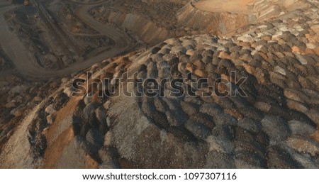 aerial photography. quarry from a bird's-eye view. dump of ore into the dunes