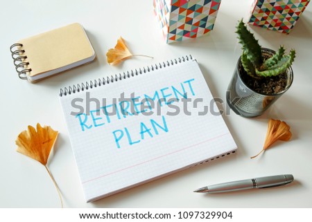 retirement plan written in notebook on white table