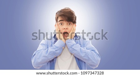 portrait and expression of surprise on the blue background