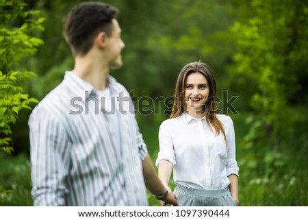 Portrait of a happy couple walking together outdoors