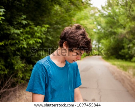 young hipster teenager walking on the alley