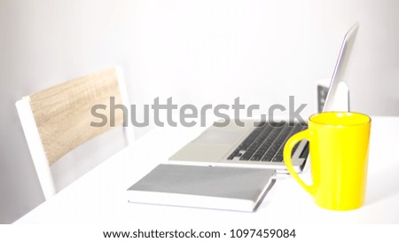 Blurry desk working concept on gray background