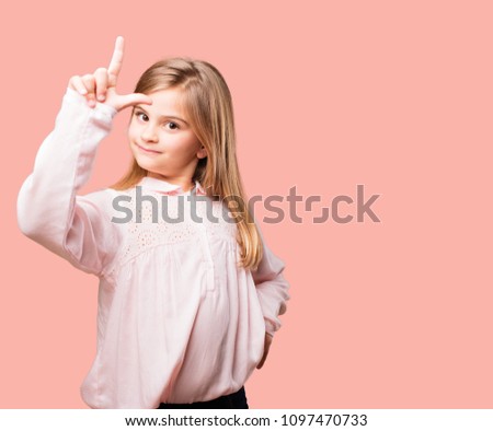 little pretty girl gesturing loser sign