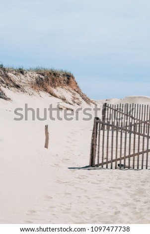 Cape Cod beach with wooden fence, nature background
