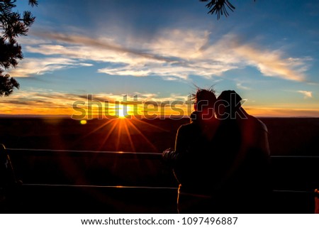 A couple watched Sunset at Grand Canyon. This picture is silhouette.
