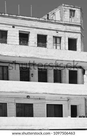 Simple building with windows, doors and balconies in the style of constructivism on Malta. Black and white picture