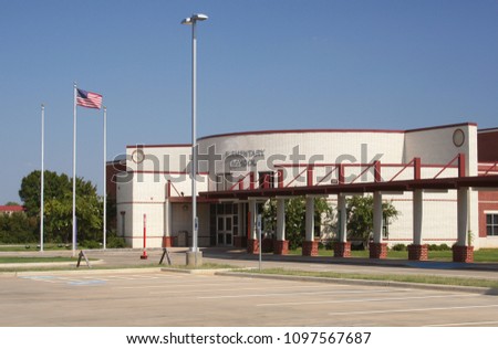 Elementary School Building With American flag