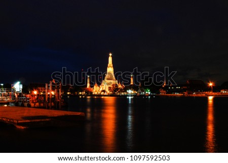 Wat Arun Nightscape view, Bangkok - Thai language appear in picture mean name of public pier ( Tha Tien ) at Chao Phraya River