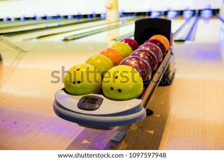 Blurry of balls for bowling game with blurry bowling lanes.