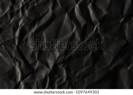 Blank crumpled black paper