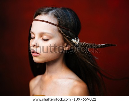 beautiful girl with long hair and with feather
