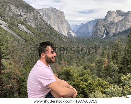 Portrait of a tourist at vista point in Yosemite National park. 