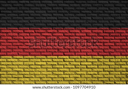 Germany flag is painted onto an old brick wall