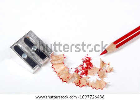 pencil and sharpener with pencil shaving isolated on white background 