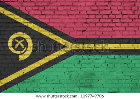 Vanuatu flag is painted onto an old brick wall