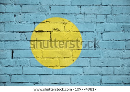 Palau flag is painted onto an old brick wall