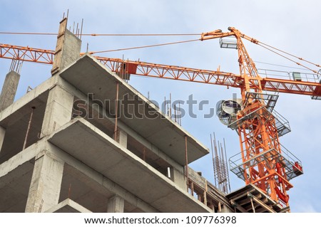 Lifting crane on a background sky