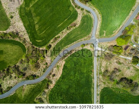 Aerial photograph of maintained lawn and road.
