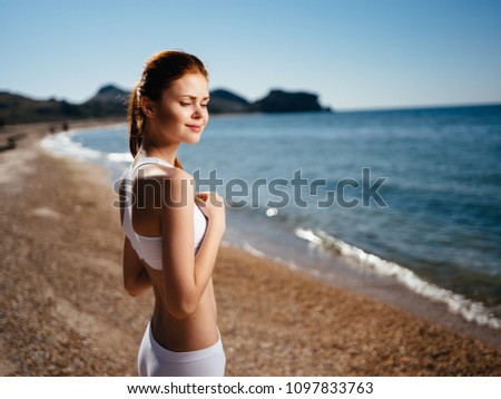 Sports woman near the sea