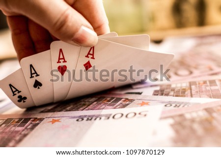 playing cards on the table and money