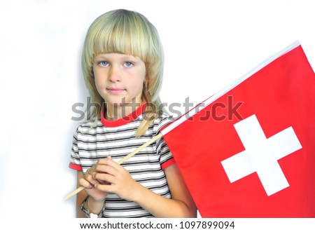 Adorable boy with a national flag of Switzerland on white background