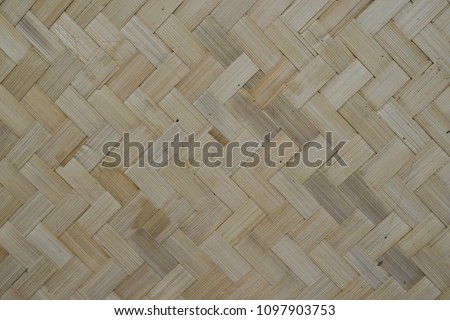 traditional thai style pattern nature background of brown handicraft weave texture bamboo surface for furniture material
