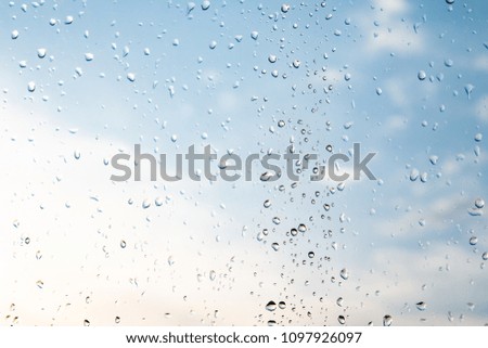 raindrops on the glass blue sky