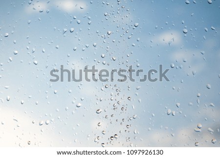 raindrops on the glass blue sky