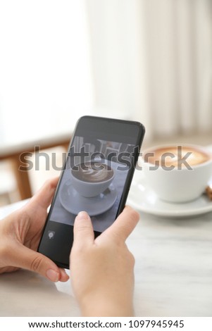Close up of women hands take a picture coffee in coffee shop