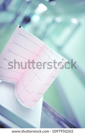 Heart examination test result on the background of blurred hospital corridor.