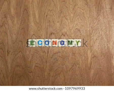 Word Economy on wood background