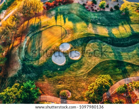 Aerial drone picture of Regatta Bay Golf Course in Destin Fl. Green colorful fall colors.