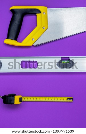 Hand tools wood saw, stapler, tape measure